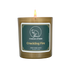 A lit soy candle within a golden vessel is against a white background. The label is greyish cyan featuring the logo of a white cat silhouette, the name of the company Creature of Habit, and the scent name Crackling Fire.